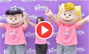 Brenda Song holding hands with Peanuts characters Lucy and Frieda